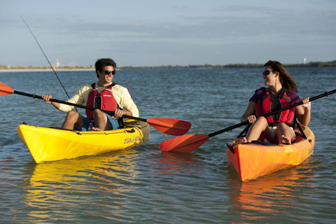 a Couple enjoying a free 20th Street Beach & Bikes Stand Up 2 hour kayak rental at Newport Beach, California, offered by Xplorie participating properties.