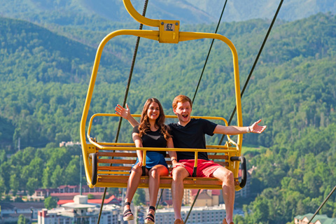 A couple sitting above the trees on the Gatlinburg Skylift in Pigeon Forge, Tennessee. Guests staying at Xplorie participating properties can enjoy one free admission to this amazing show!