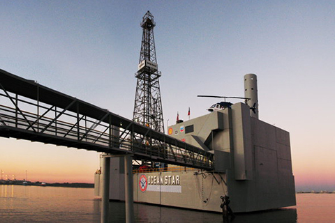 A view of the Ocean Star Offshore Drilling Rig Museum at sunset in Galveston, Texas, where guests staying at Xplorie participating properties can enjoy a free admission.